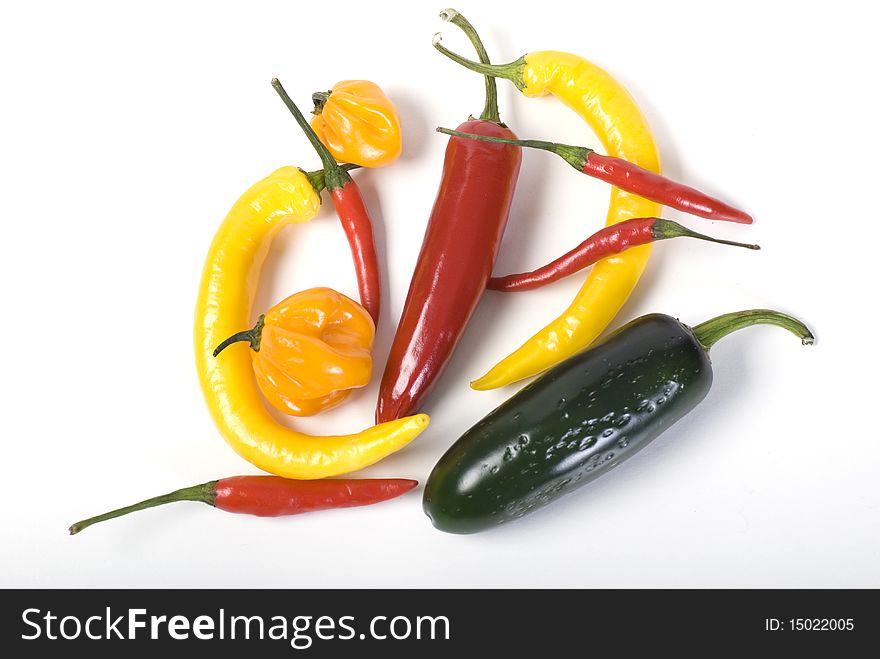 Shot of different sort of chili isolated on white background. Shot of different sort of chili isolated on white background.