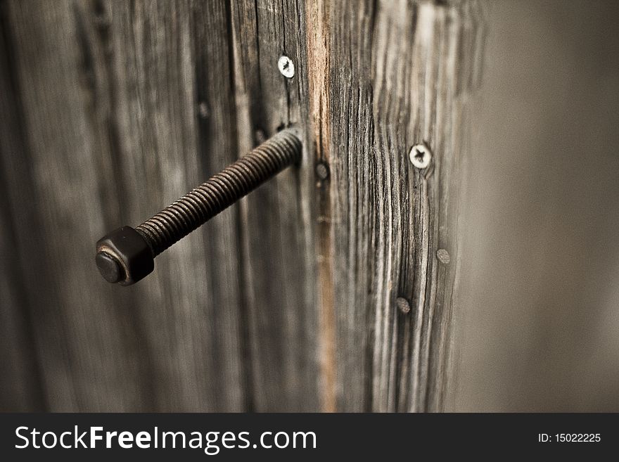 An old wood bolt, aged by the years but remaining resolute