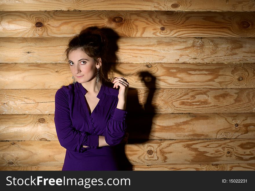 Beautiful young woman standing at the wall. Beautiful young woman standing at the wall.