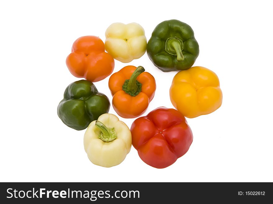 Paprika pieces in five different colors isolated on white background