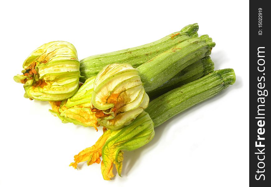 Courgettes(zucchini) with edible flower isolated on white background