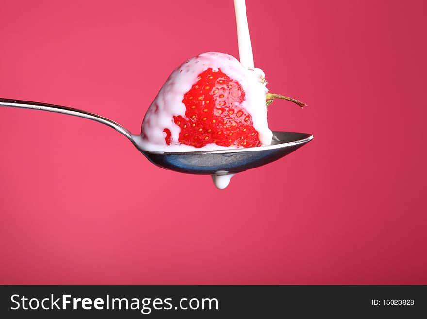 Close-up view of fresh strawberry with cream. Close-up view of fresh strawberry with cream