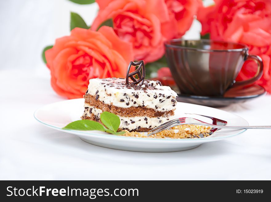 Sweet chocolate dessert with nuts, rose and cup of coffee. Romantic sweet mood