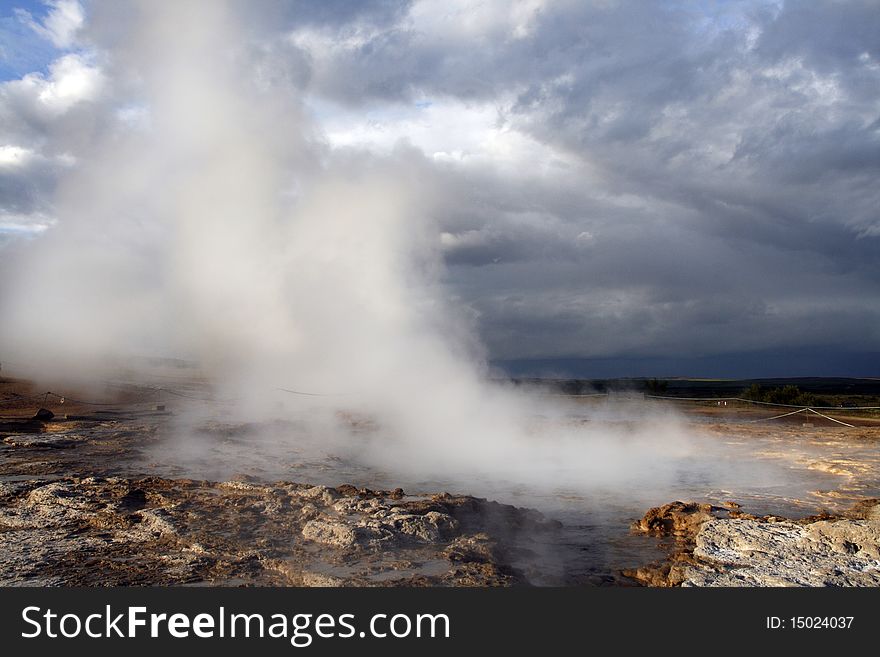 Geothermal area in Geysir region in Iceland. Famous geyser Stokkur just after the eruption.