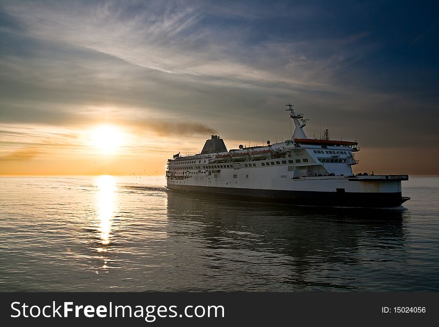 Ferry Boat On The Sunset In The Sea