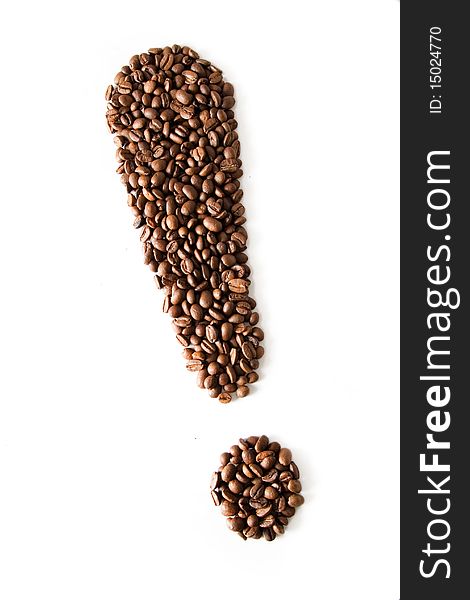 Coffee grains lying in the shape of exclamation mark. Coffee grains lying in the shape of exclamation mark