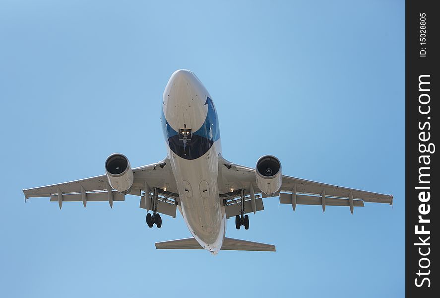 Airliner Makes its Landing Approach with a blue sky