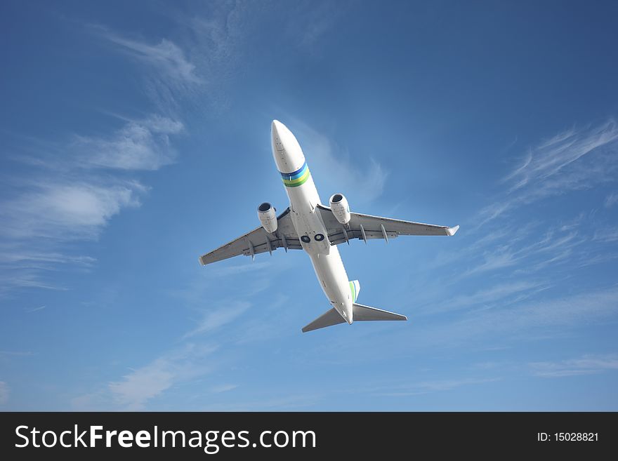 Airplane flying against a blue sky