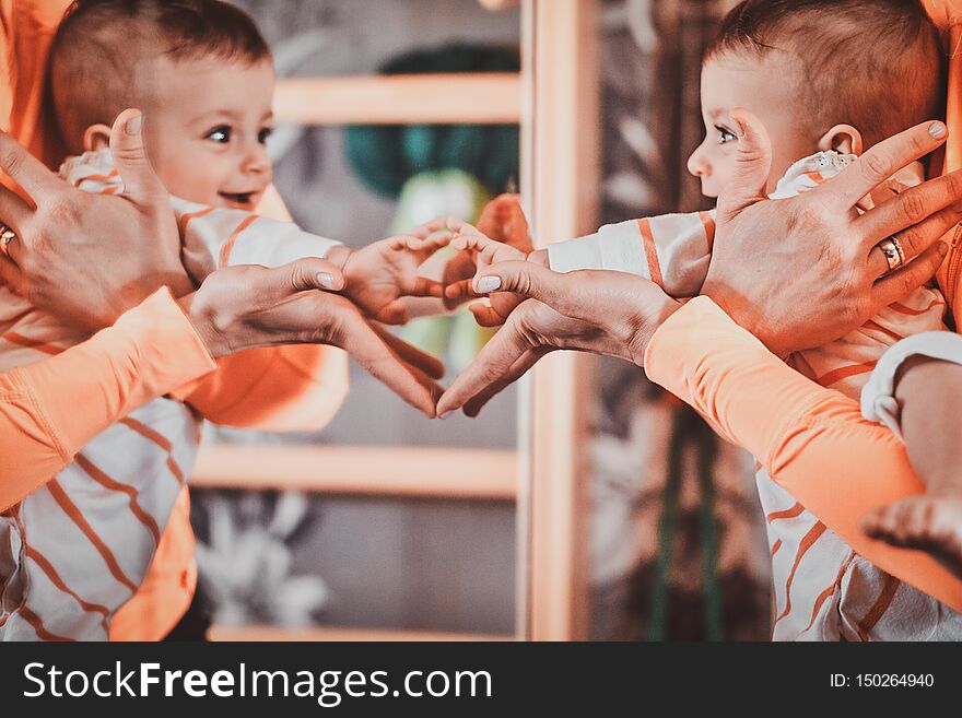 Toddler Is Recognize Himself In The Mirror And Feel Very Happy About It.