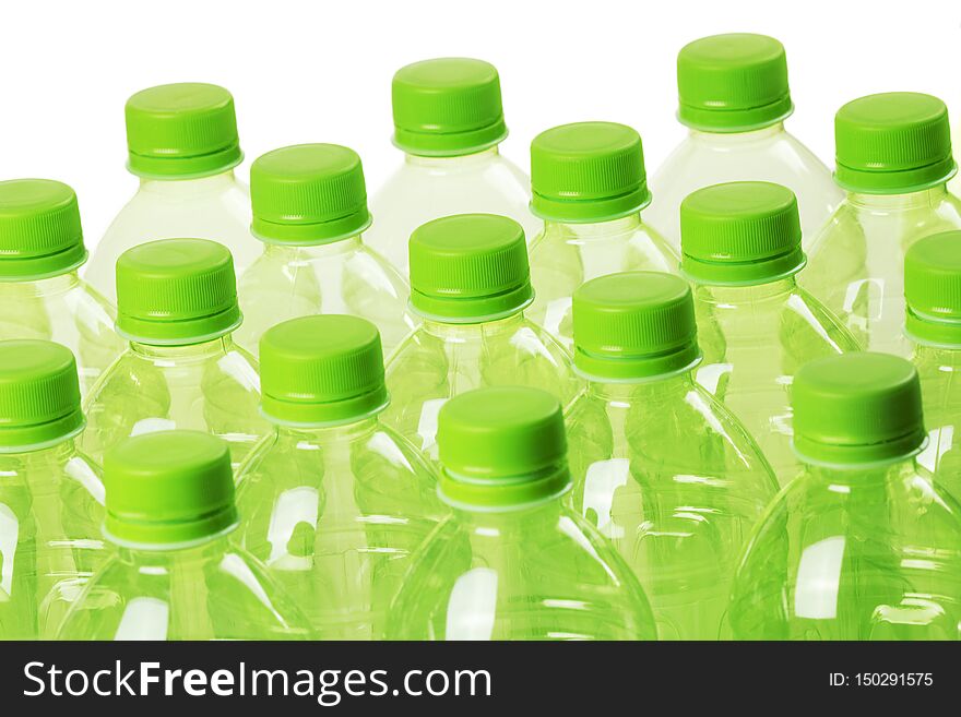 A collection of green plastic bottles isolated on a white background