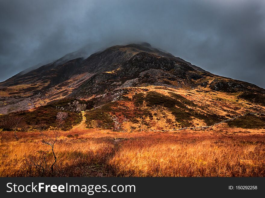 A Moody View Of A Rocky Mountain In Glencoe, Scotland