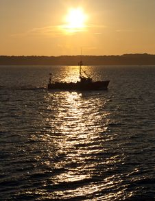 Commercial Fishing Boat At Sunset Royalty Free Stock Photo
