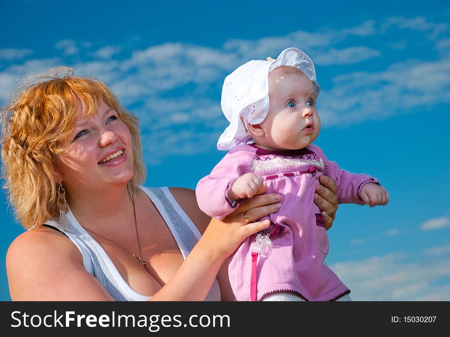 Baby in mothers arms at summer season. Baby in mothers arms at summer season