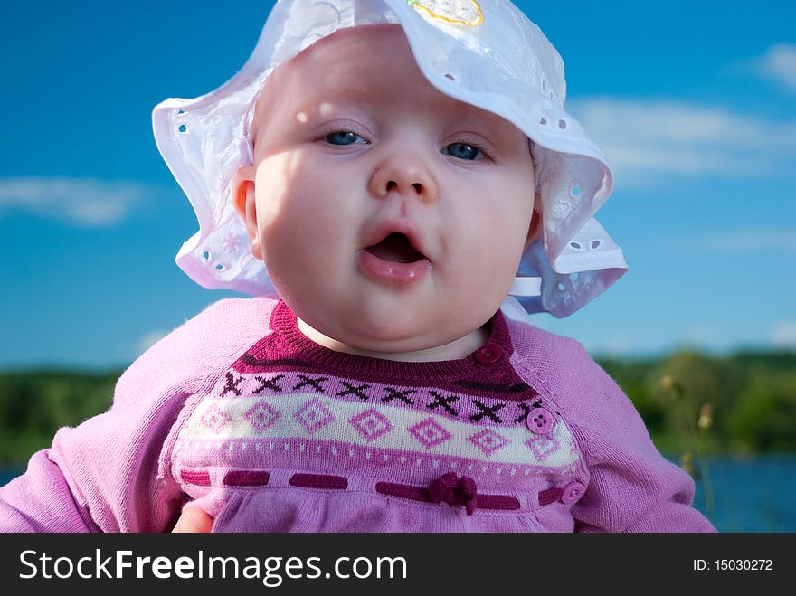 Funny little baby in a hat at summer season. Funny little baby in a hat at summer season