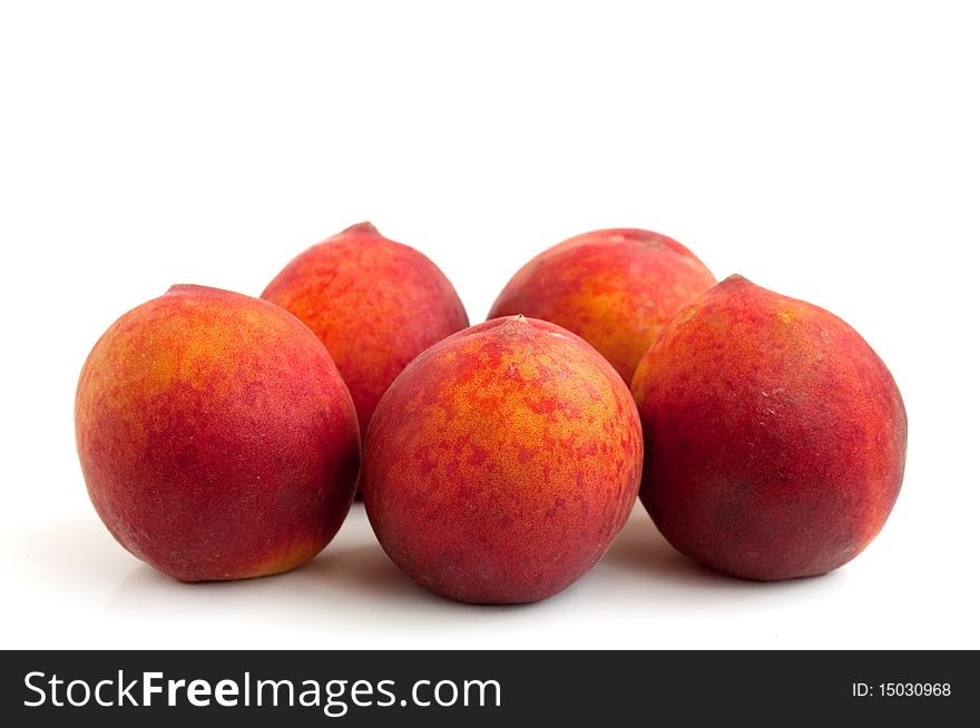 Ripe, juicy peach on a white background