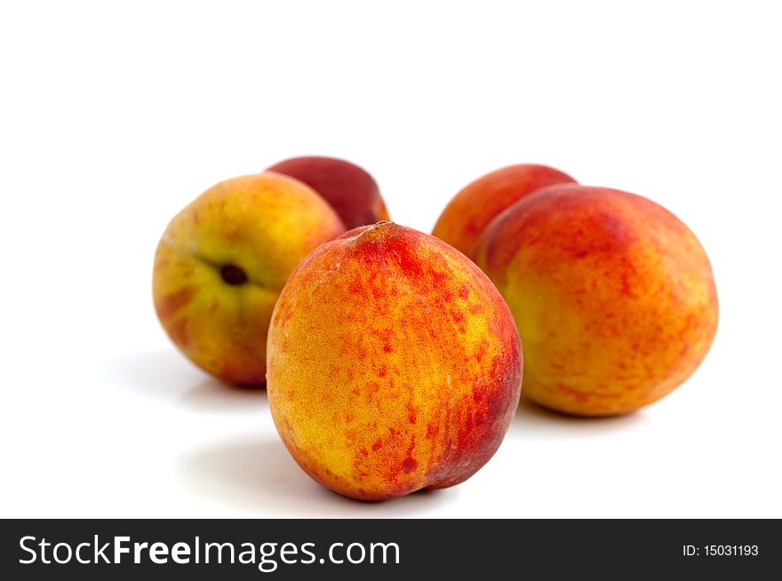 Ripe, juicy peach on a white background