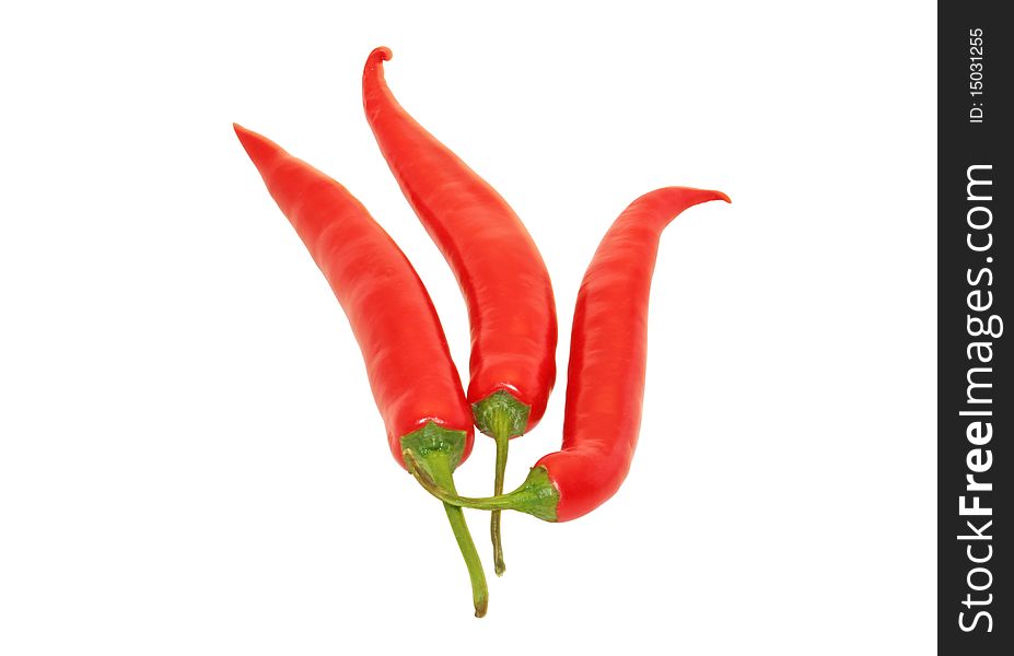 Three red chili peppers isolated on a white background