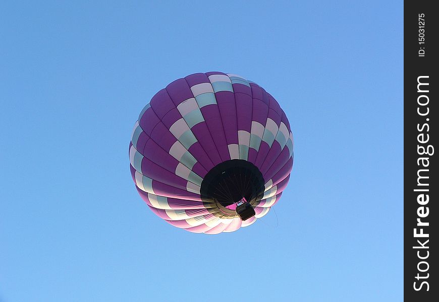 Balloon in low flight as it passes overhead.  Taken at the 2010 Kansas City Hot Air Balloon Invitational at Gardner, KS. Balloon in low flight as it passes overhead.  Taken at the 2010 Kansas City Hot Air Balloon Invitational at Gardner, KS.