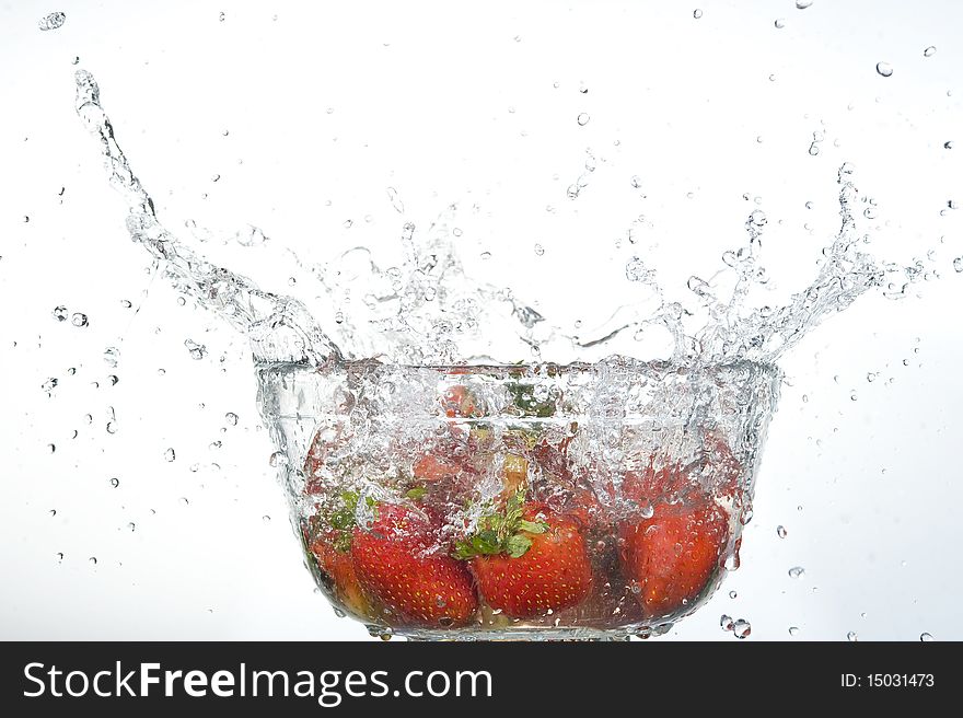 Red Strawberries  splashing in fresh water