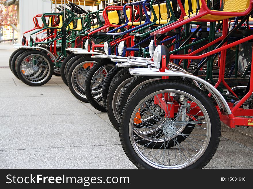 A row of bicycles waiting to be rented. A row of bicycles waiting to be rented.