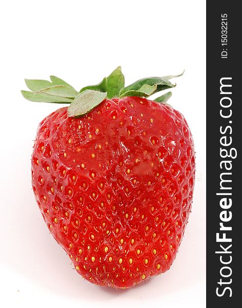 Strawberry in the foreground on white background. Strawberry in the foreground on white background