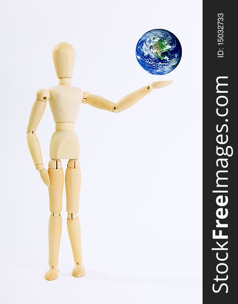 Wooden doll with planet on his hand. Wooden doll with planet on his hand