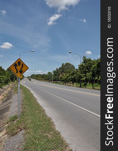 Two way traffic symbol with blue sky