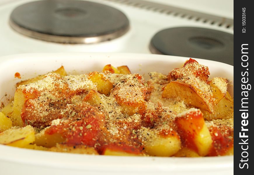 Delicious baked potatoes nicely presented on a electric hob.