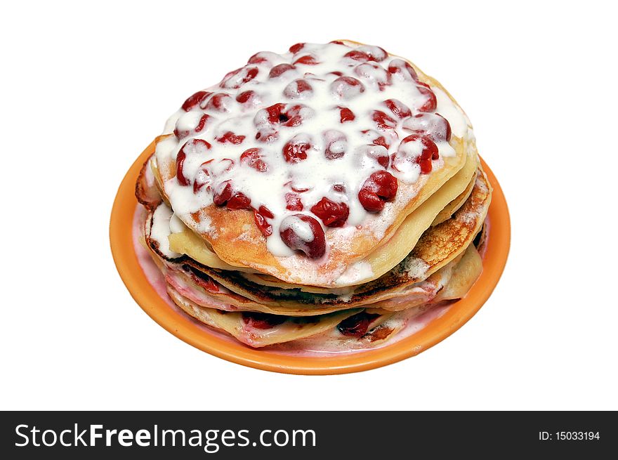 Pancakes with cherries on white background.Isolate with path
