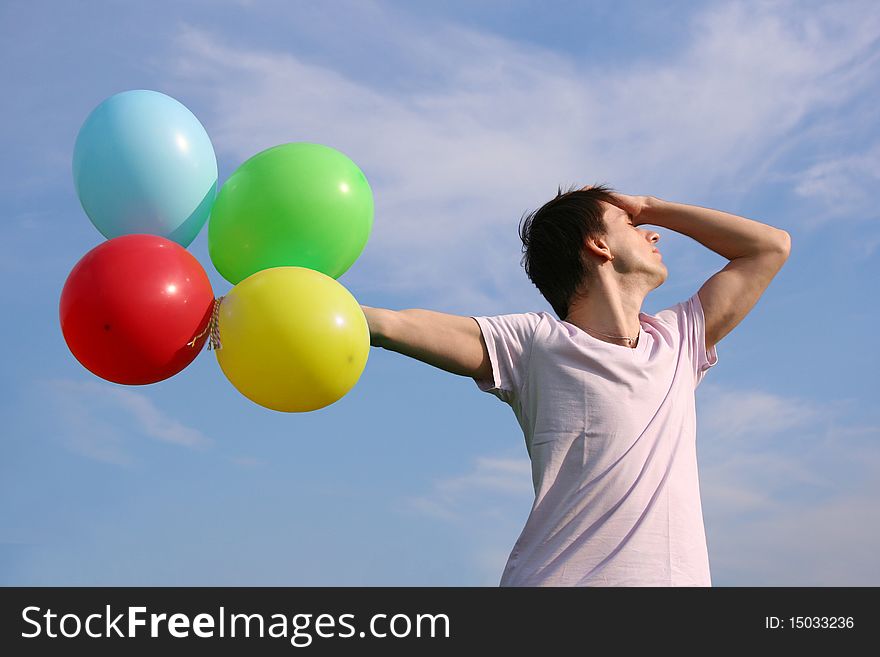 Young Man With Many Colored Balloons