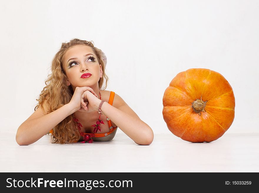 Young Girl With A Yellow Pumpkin