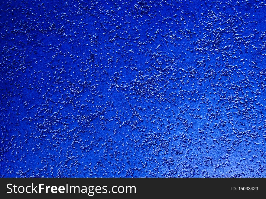 A unique looking of a deep blue wall paper.