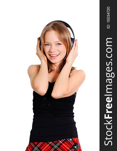 Pretty cheerful teenage girl listening to music. Pretty cheerful teenage girl listening to music