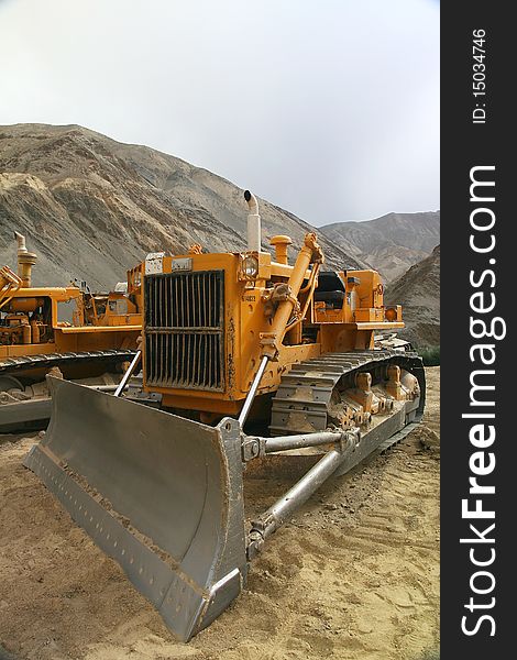 Heavy yellow bulldozer at ladakh in the himalayas. Heavy yellow bulldozer at ladakh in the himalayas