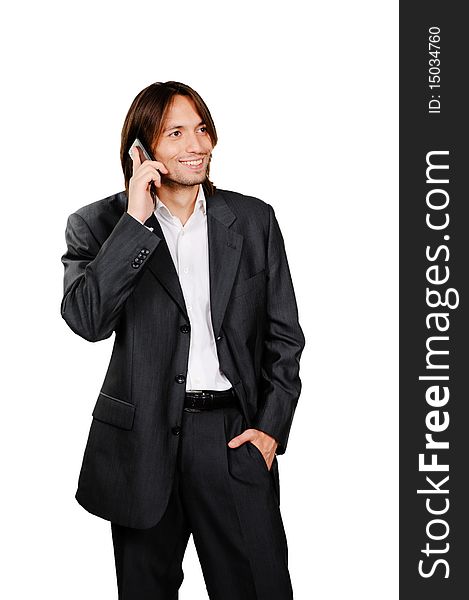 Young confident businessman speaking on the cell phone (isolated on white background)