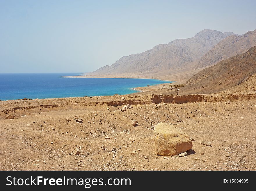 View of a tropical coastline from the desert. View of a tropical coastline from the desert
