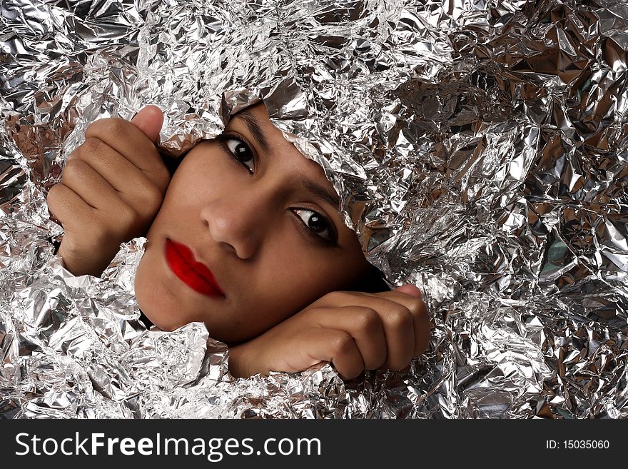 African beauty woman wrapped in foil. African beauty woman wrapped in foil