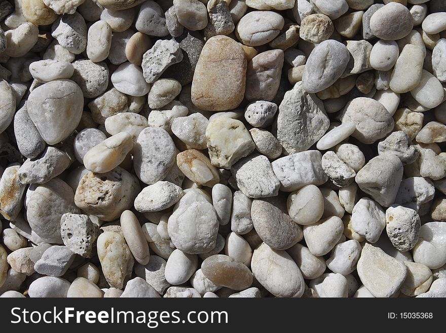 Pebble background taken in daylight at the beach