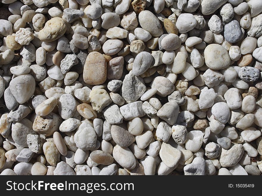 Pebble background taken in daylight at the beach