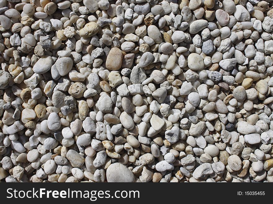 Pebble background taken in daylight at the beach