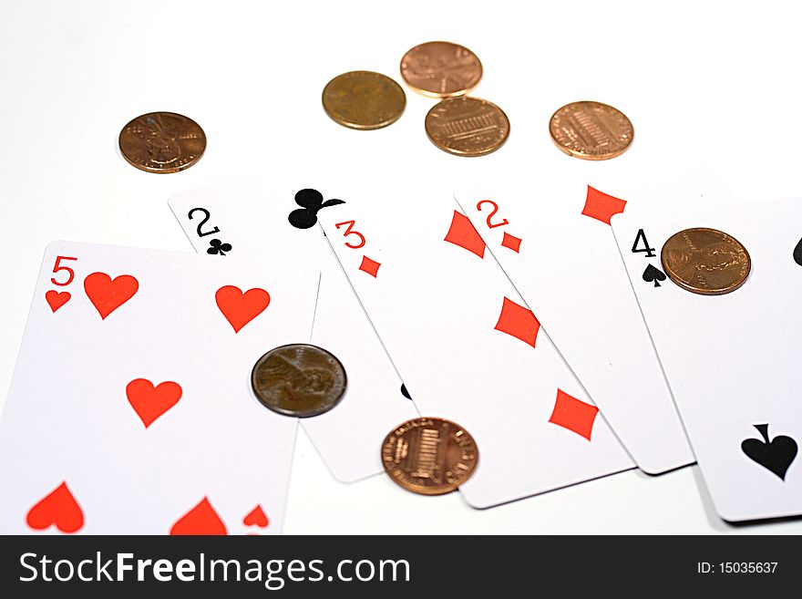 Five playing cards and pennies.