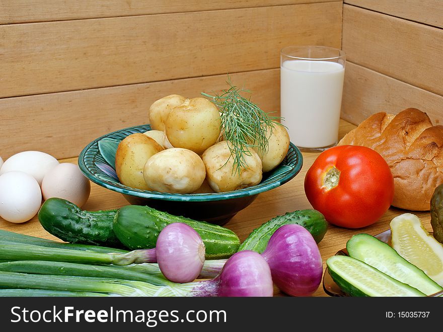Appetizing boiled potatoes and  palatable makeup vegetable -country food. Appetizing boiled potatoes and  palatable makeup vegetable -country food