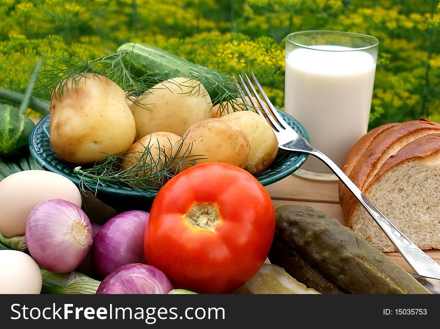 Appetizing boiled potatoes and palatable makeup vegetable -country food. Appetizing boiled potatoes and palatable makeup vegetable -country food