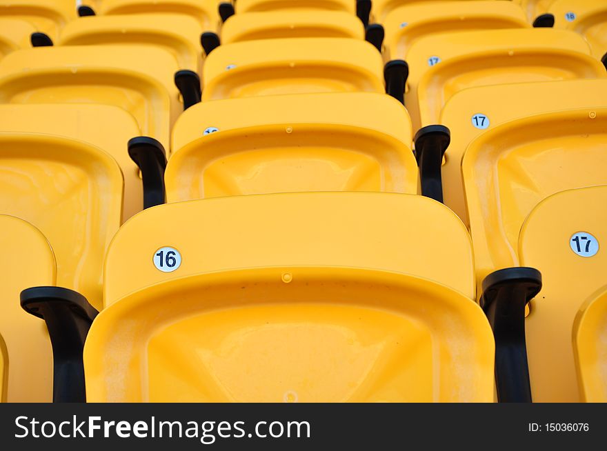 Folding yellow seat in arena