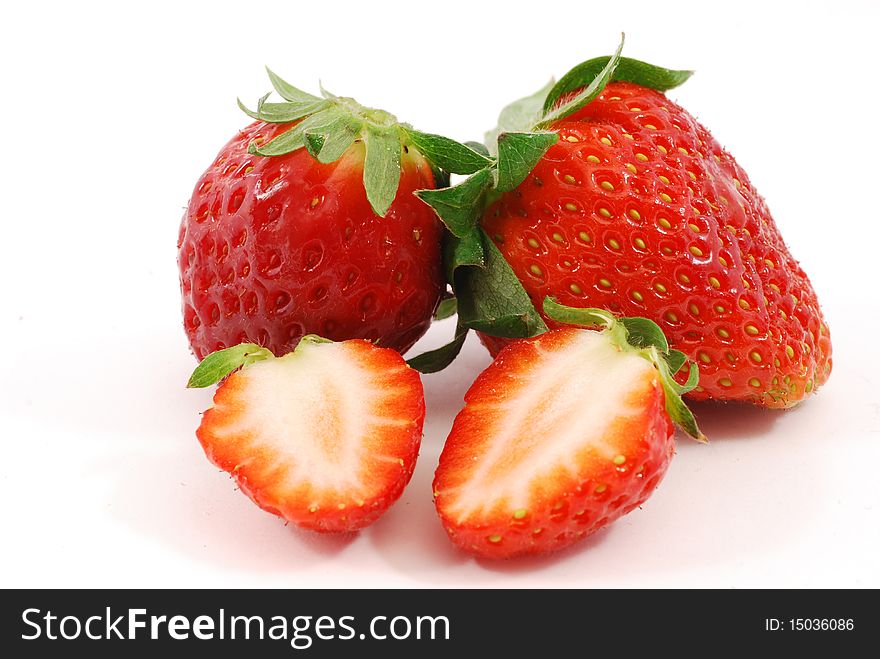 Whole strawberries and cut strawberries. Whole strawberries and cut strawberries