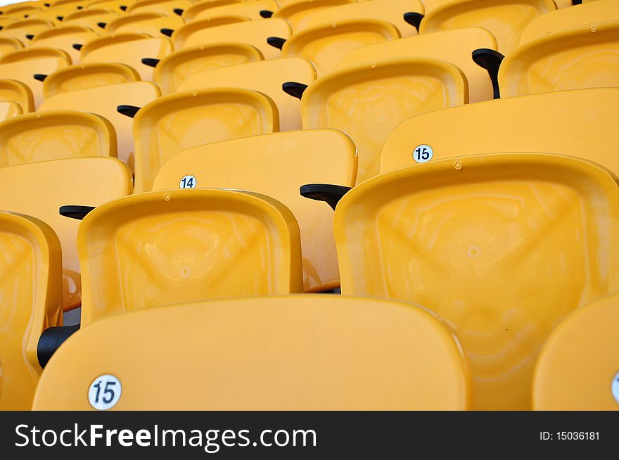 Folding yellow seat row in arena. Folding yellow seat row in arena