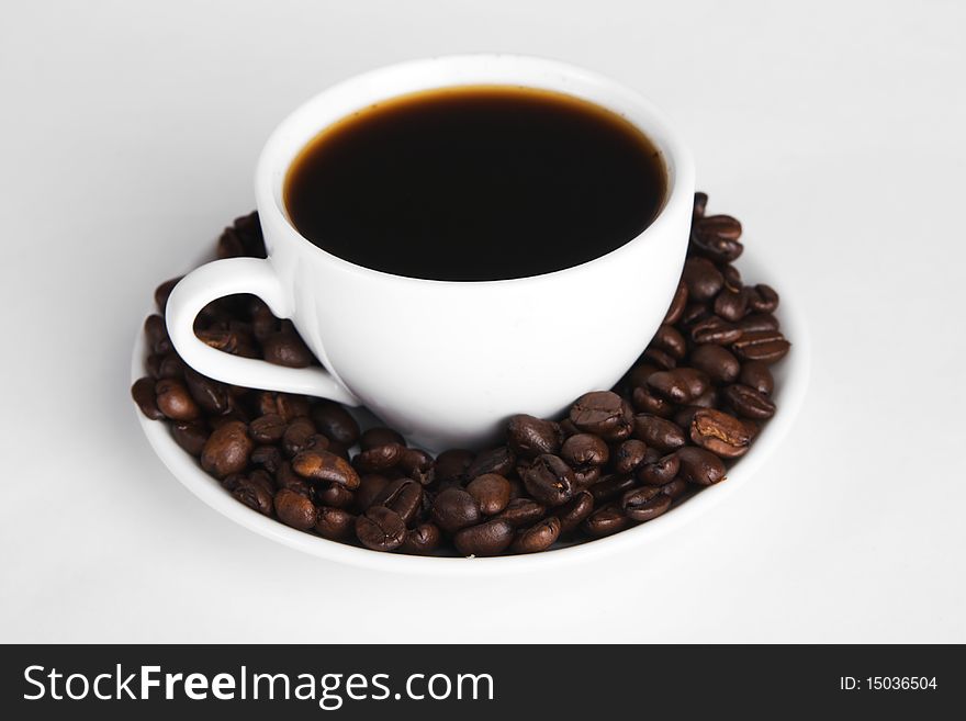 Cup of strong coffee, neutral background