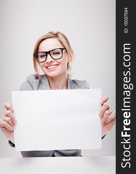 Young business woman holding empty white board