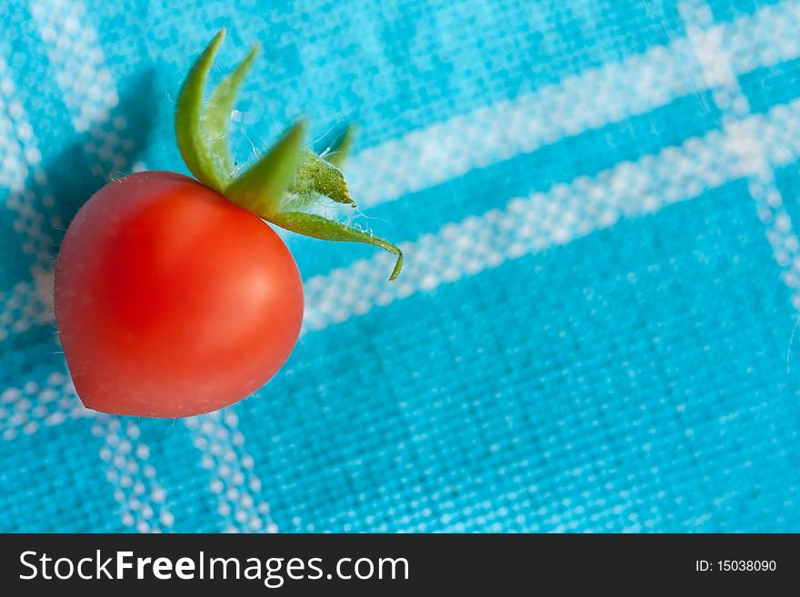 Cherry tomato on blue and white kitchen cloth