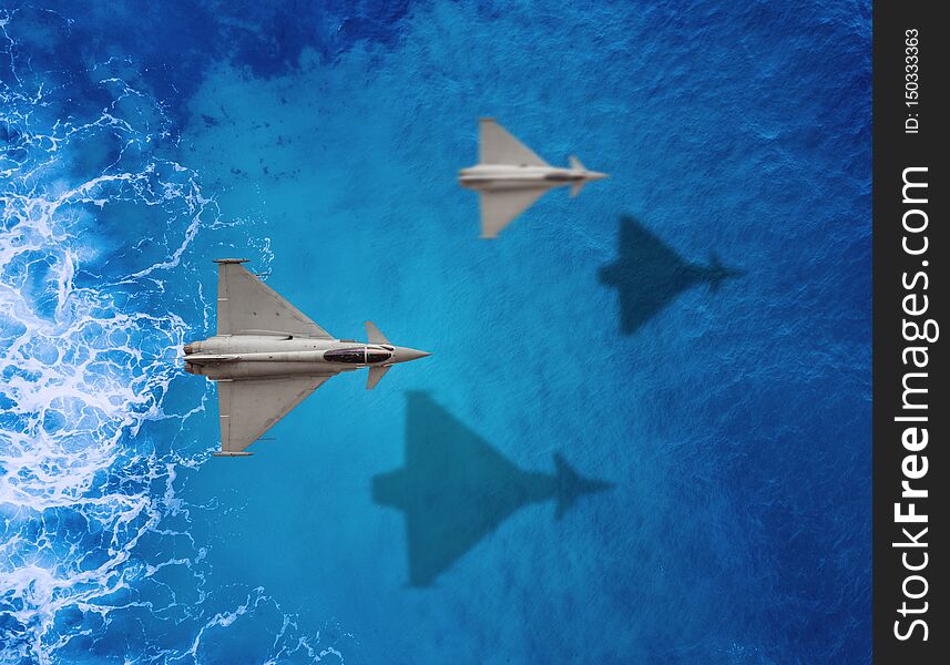 Two Fighters plane flies over a sea